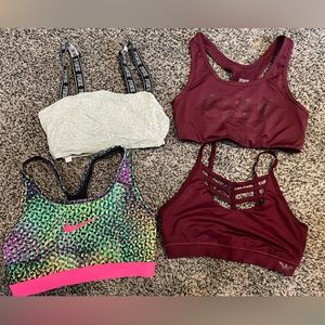 4 Size Small women’s sport bras! Two PINK, one NIKE, one WONDER WOMAN